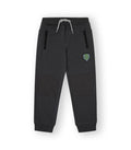 Pantalón deportivo niño negro con letras en pernera. Modelo Team