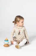 Vestido beige con bordado de perrito para bebé niña